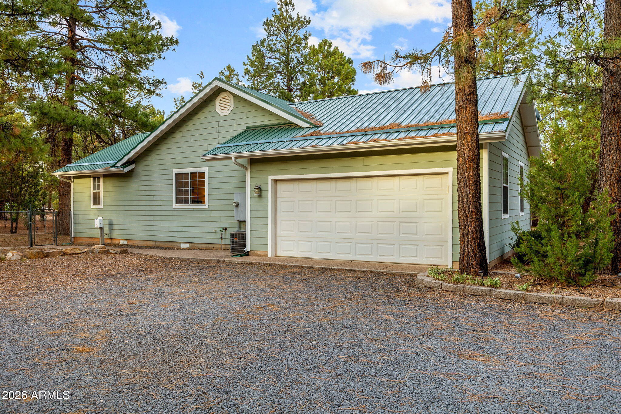 2236 Cross Country Road Overgaard, AZ 85933 - Photo 41 of 59 a view of a house with a garage and yard