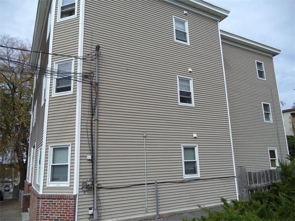 13-15 Amity Street Lynn, MA 01902 - Photo 13 of 15 a view of a house that has a large window
