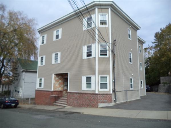 13-15 Amity Street Lynn, MA 01902 - Photo 15 of 15 a front view of a house with a road