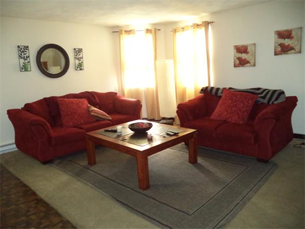 13-15 Amity Street Lynn, MA 01902 - Photo 4 of 15 a living room with furniture and a window