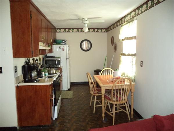 13-15 Amity Street Lynn, MA 01902 - Photo 5 of 15 a view of a dining room with furniture and window