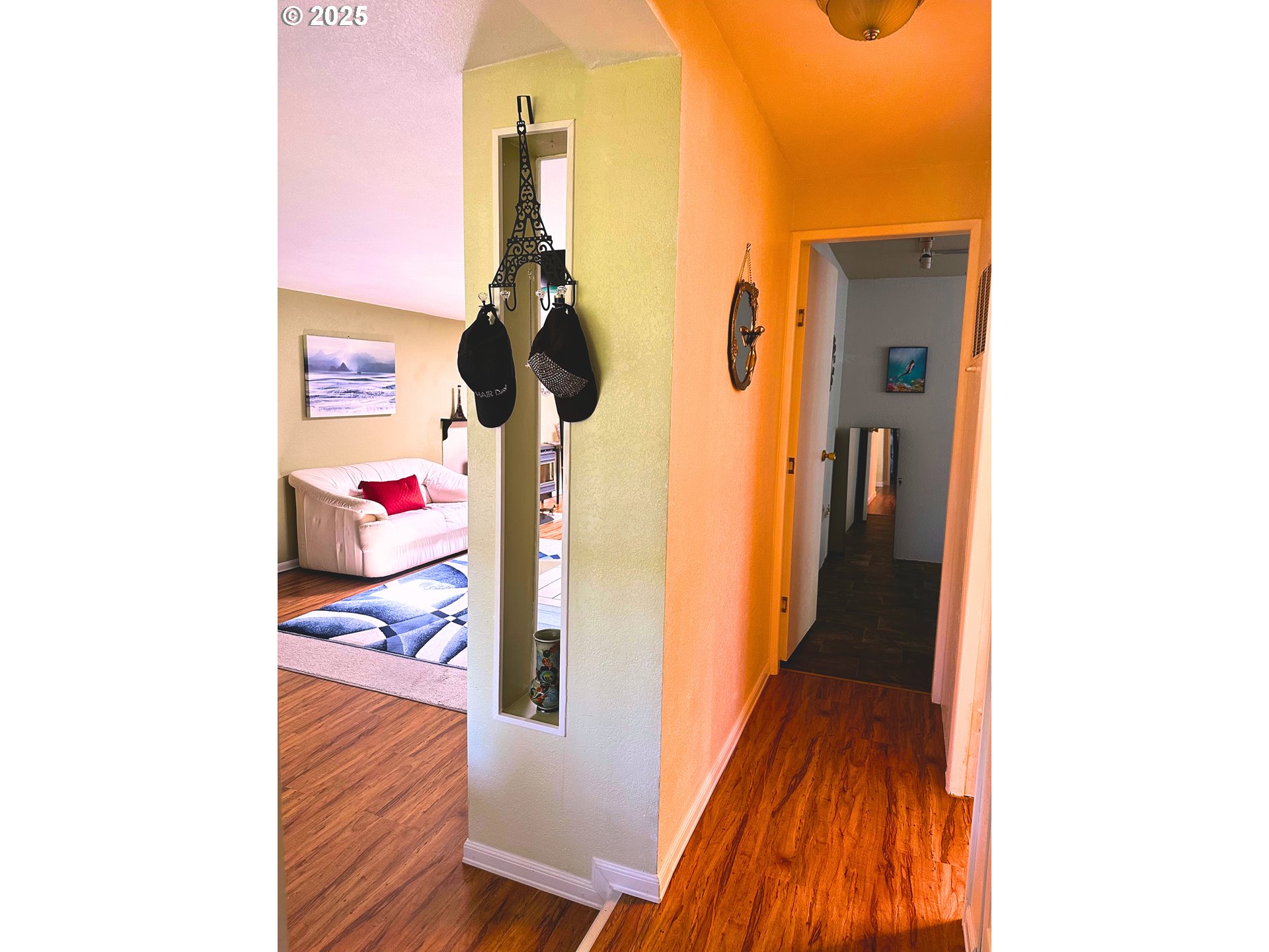 1600 Rhododendron Drive, Unit 218 Florence, OR 97439 - Photo 15 of 40 a hallway with a view of living room with wooden floor