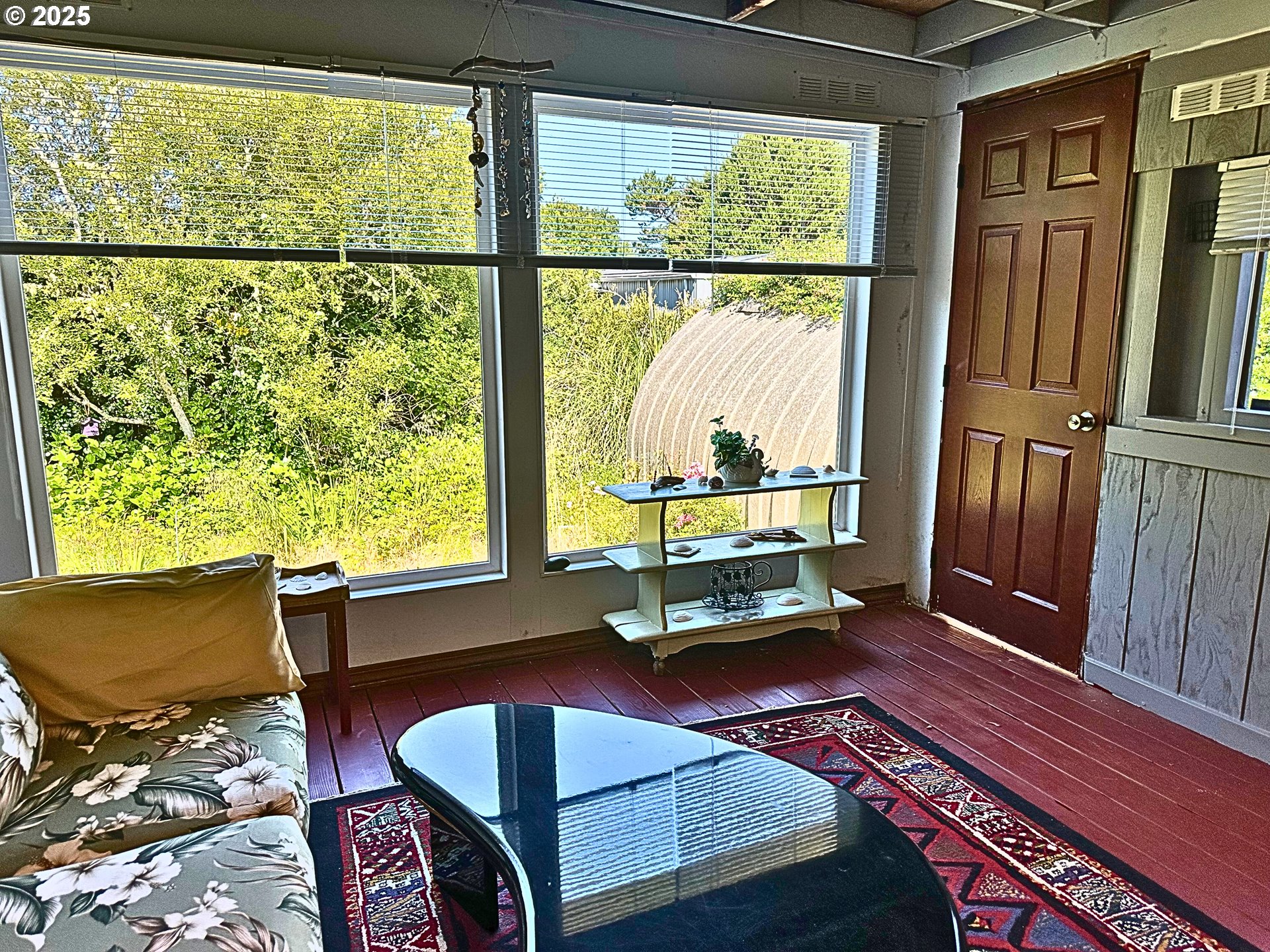 1600 Rhododendron Drive, Unit 218 Florence, OR 97439 - Photo 18 of 40 a living room with a couch and a table