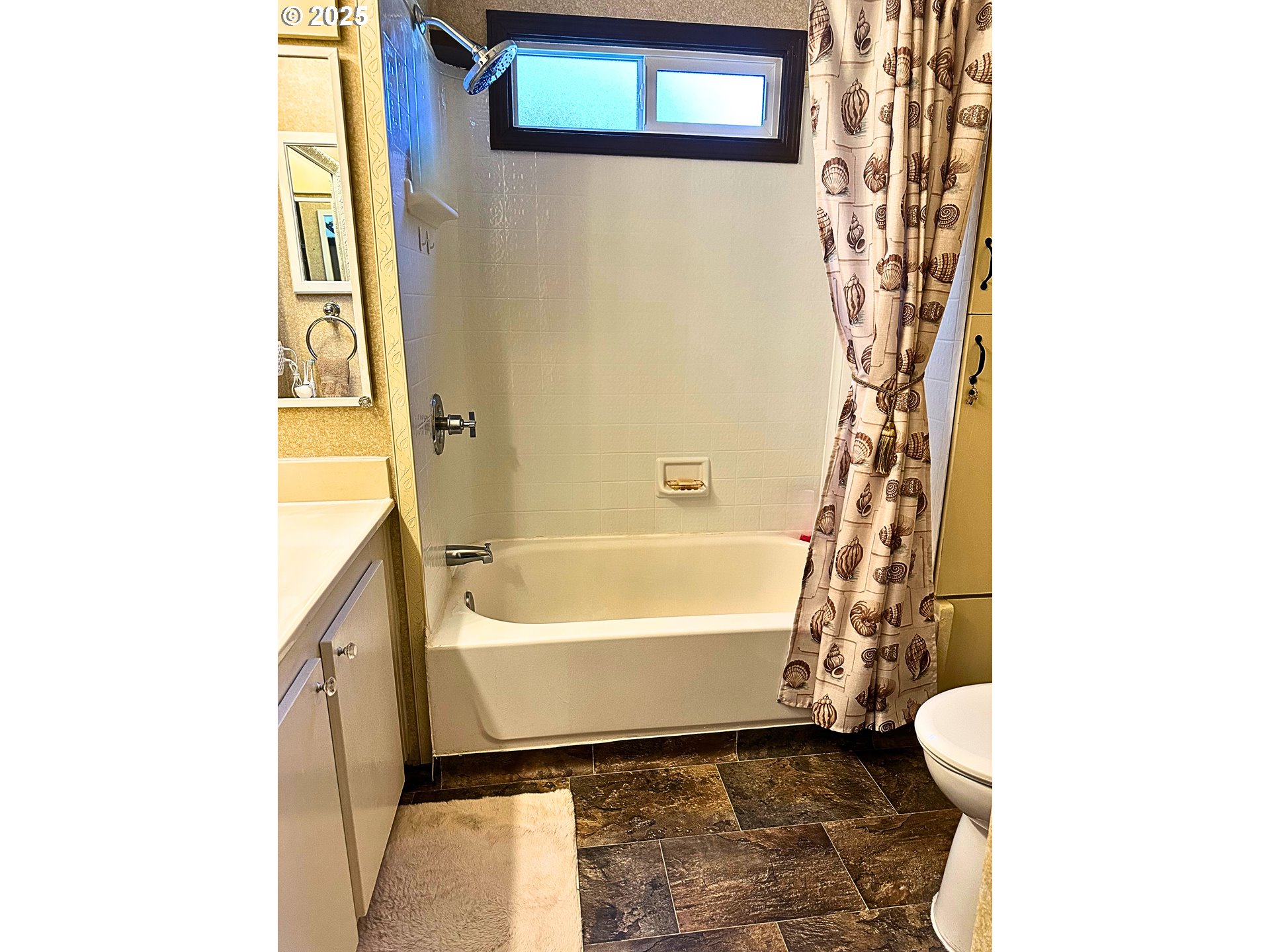1600 Rhododendron Drive, Unit 218 Florence, OR 97439 - Photo 10 of 40 a bathroom with a bathtub and shower