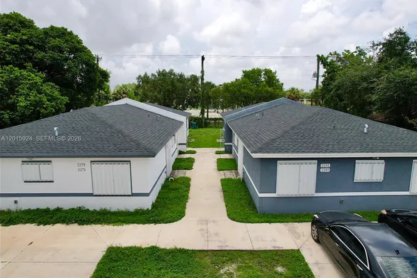 a view of house with garden space and street view