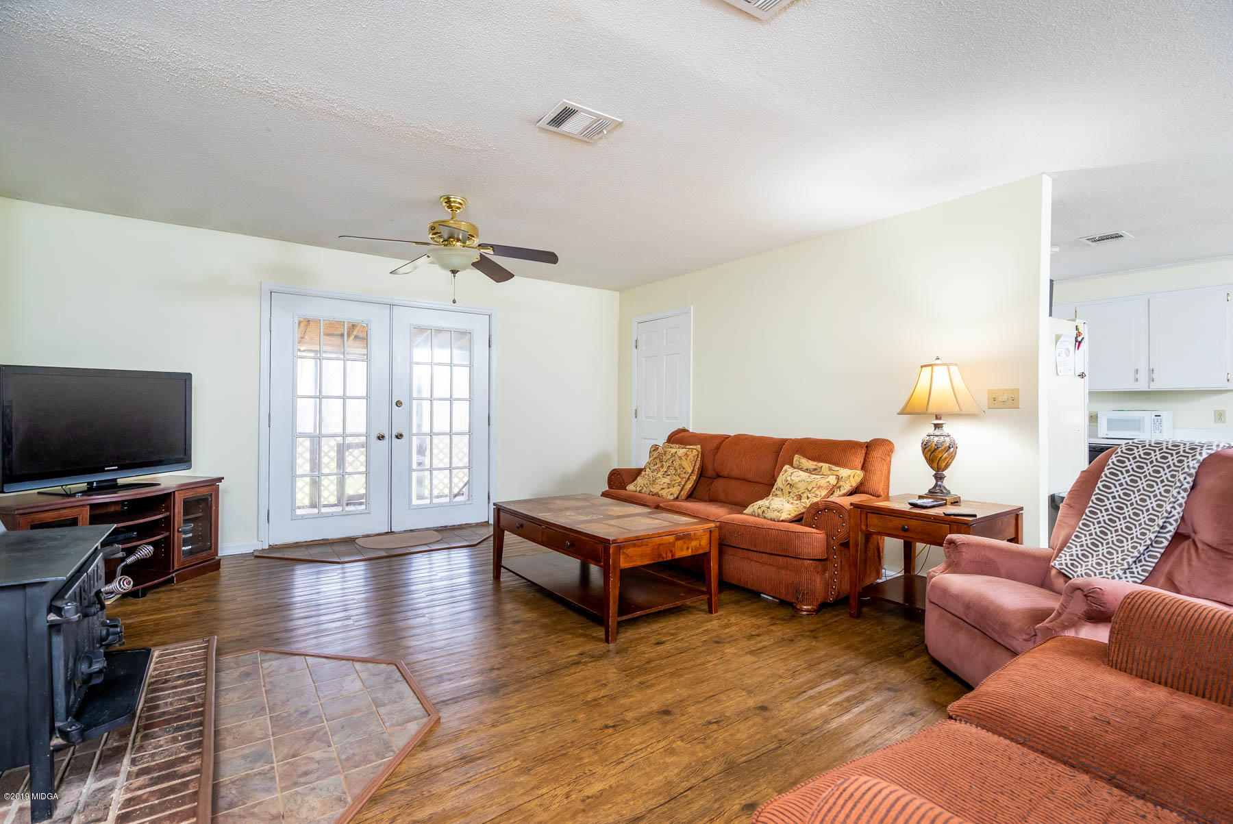 161 Taylor Road Gray, GA 31032 - Photo 2 of 13 a living room with furniture and a flat screen tv