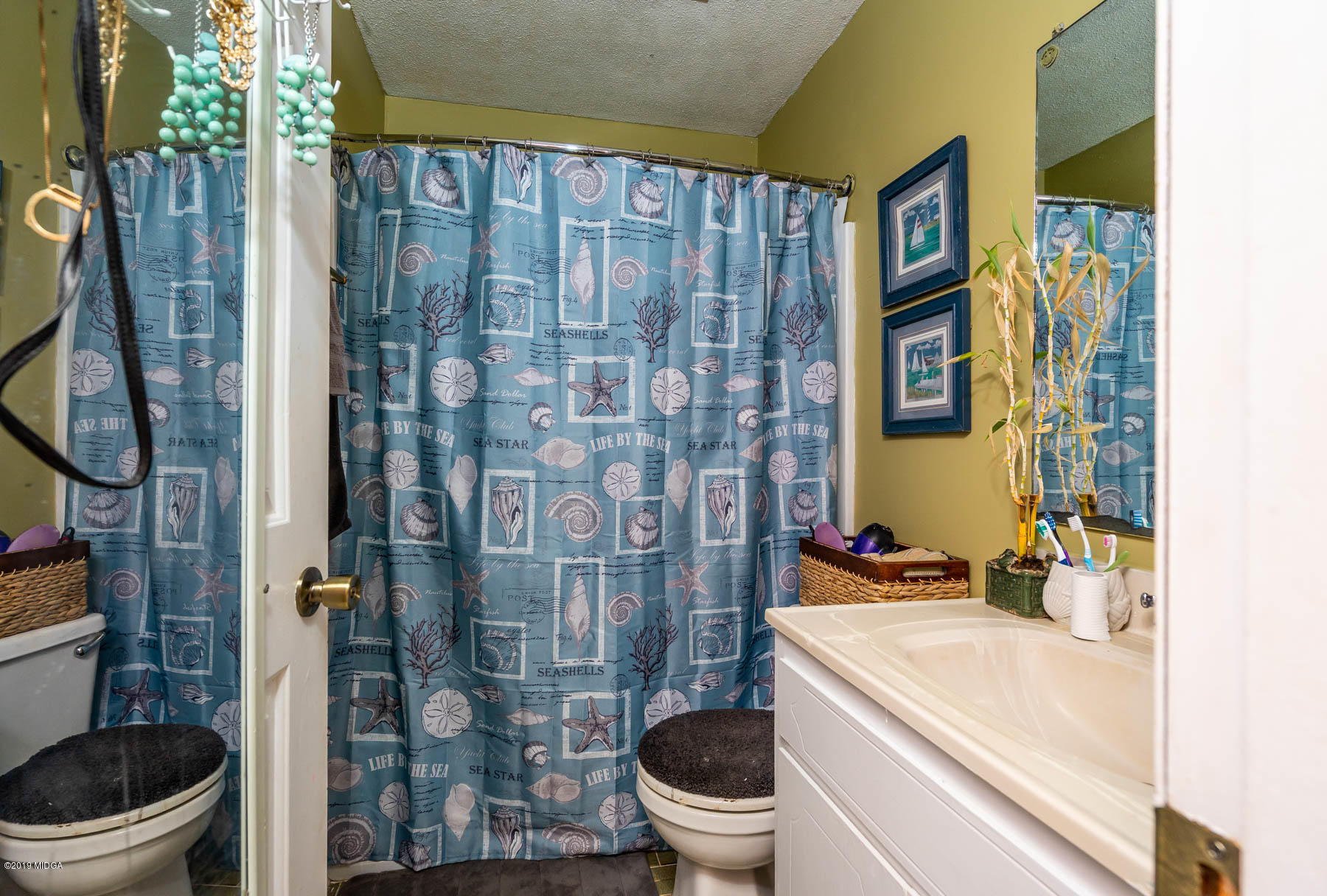 161 Taylor Road Gray, GA 31032 - Photo 12 of 13 a bathroom with a toilet and a sink