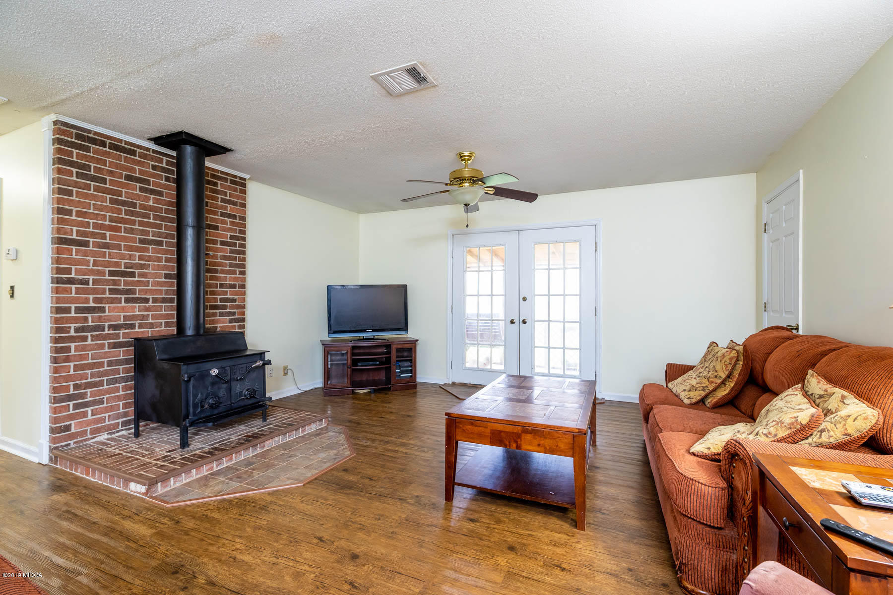 161 Taylor Road Gray, GA 31032 - Photo 3 of 13 a living room with furniture a window and a flat screen tv