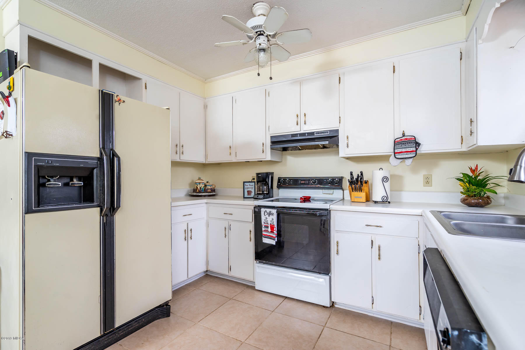 161 Taylor Road Gray, GA 31032 - Photo 5 of 13 a kitchen with stainless steel appliances granite countertop a refrigerator sink and white cabinets