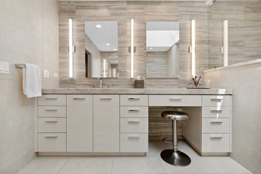 85 Riparian Road Highland Park, IL 60035 - Photo 16 of 31 a bathroom with a granite countertop sink mirror and