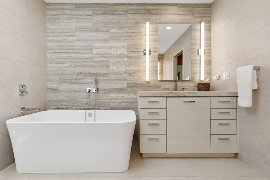 85 Riparian Road Highland Park, IL 60035 - Photo 17 of 31 a white bath tub sitting in a bathroom