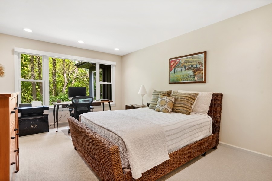 85 Riparian Road Highland Park, IL 60035 - Photo 18 of 31 a bedroom with a bed and a large window