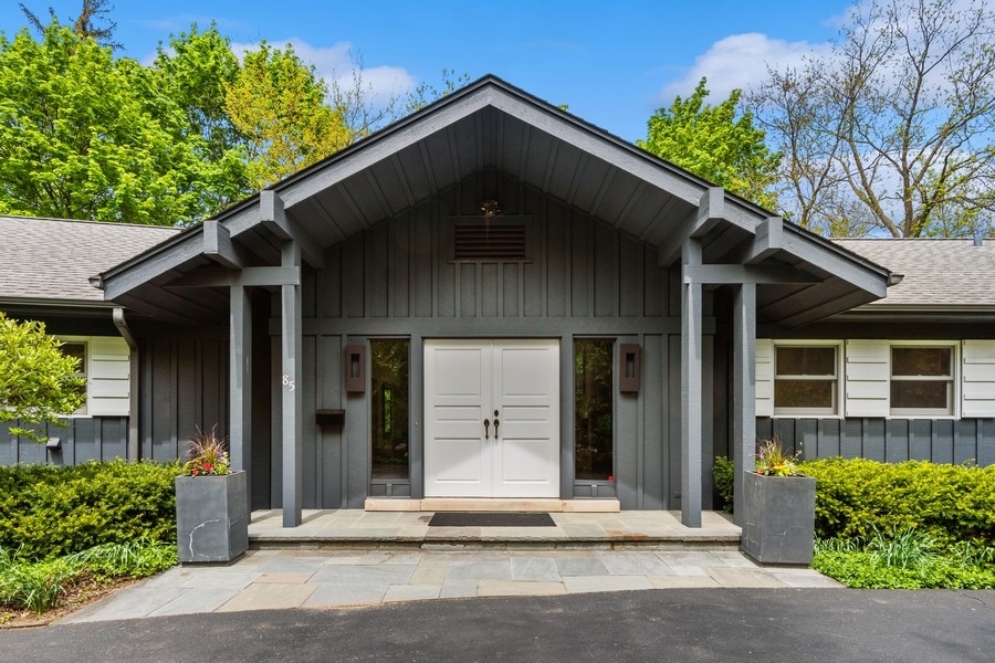 85 Riparian Road Highland Park, IL 60035 - Photo 2 of 31 a black house with outdoor space