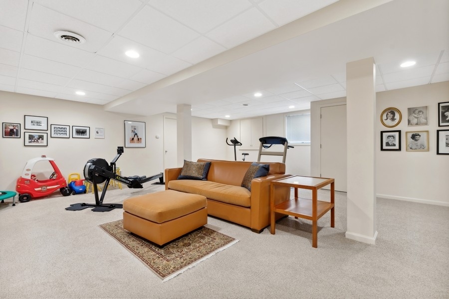 85 Riparian Road Highland Park, IL 60035 - Photo 24 of 31 a living room with furniture and a couch