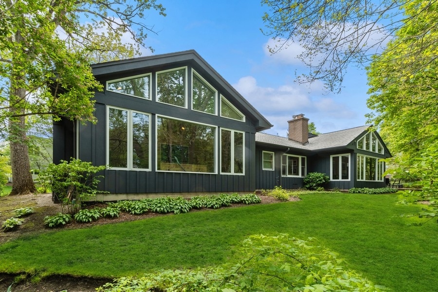 85 Riparian Road Highland Park, IL 60035 - Photo 26 of 31 a front view of a house with a garden and plants