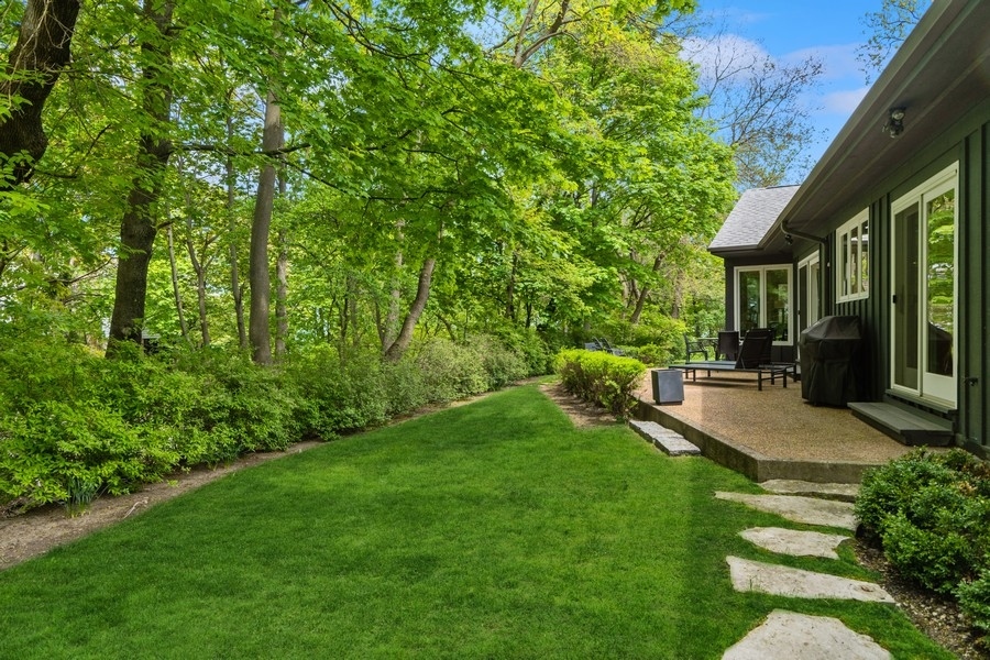 85 Riparian Road Highland Park, IL 60035 - Photo 27 of 31 a view of yard in front of house with trees