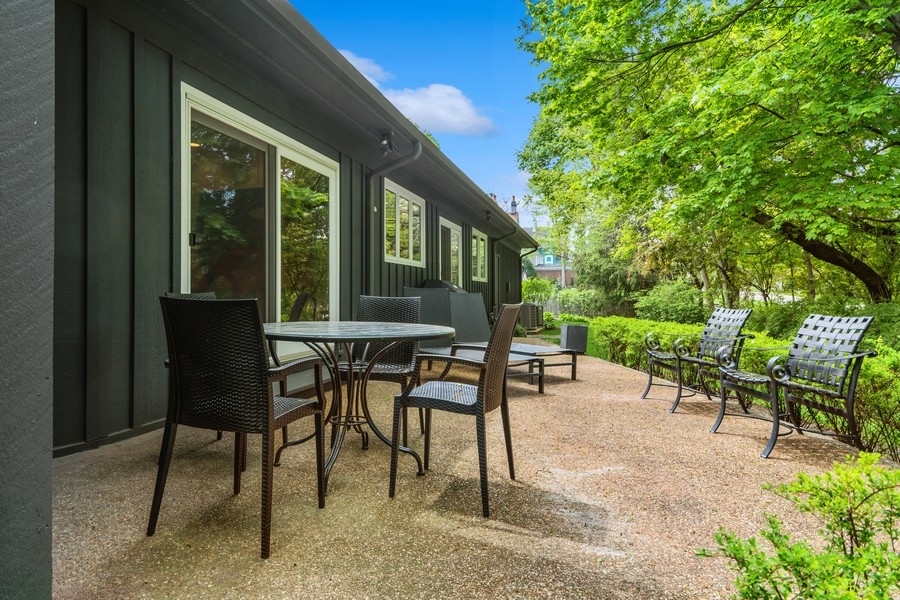 85 Riparian Road Highland Park, IL 60035 - Photo 28 of 31 a view of a patio with table and chairs and potted plants