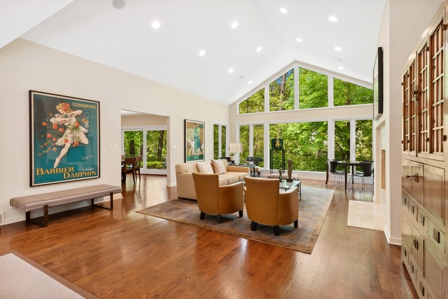 85 Riparian Road Highland Park, IL 60035 - Photo 7 of 31 a living room with furniture large windows and wooden floor