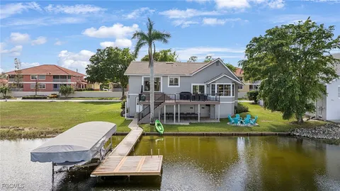 a aerial view of a house with swimming pool garden and patio