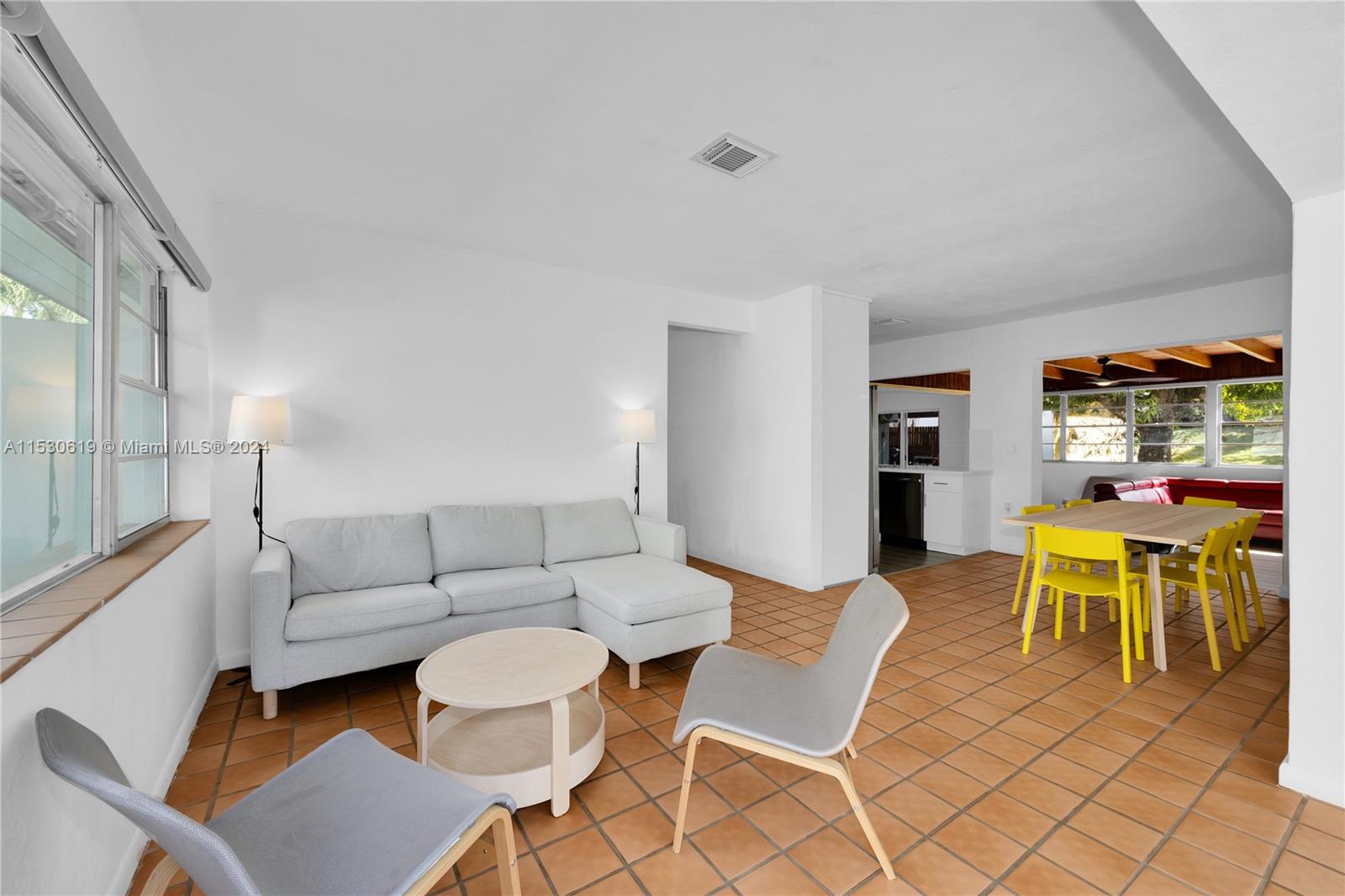 6520 Southwest 46th Street Miami, FL 33155 - Photo 11 of 40 a living room with furniture a dining table and chairs with wooden floor