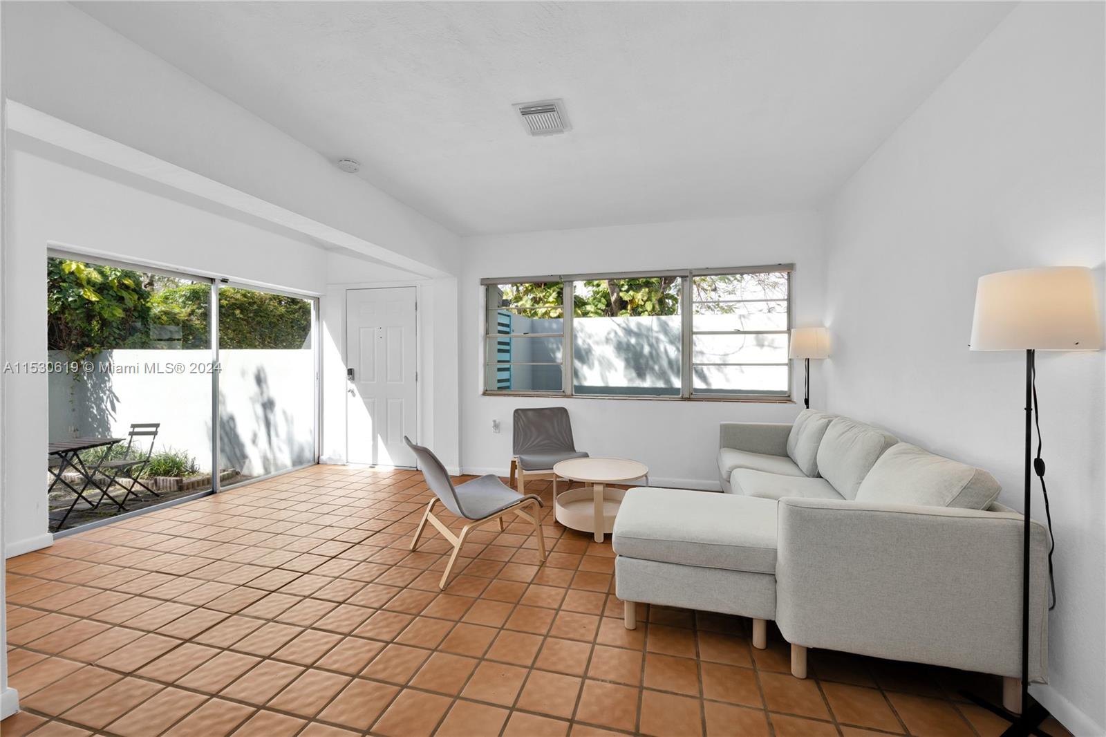 6520 Southwest 46th Street Miami, FL 33155 - Photo 13 of 40 a living room with furniture and a large window