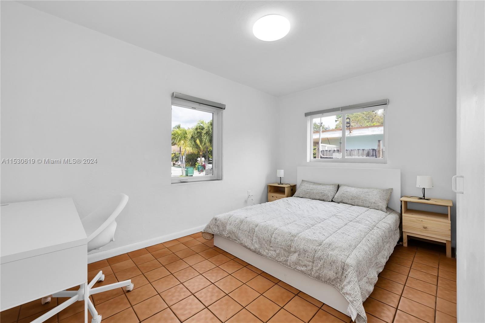 6520 Southwest 46th Street Miami, FL 33155 - Photo 24 of 40 a bedroom with a bed and a window