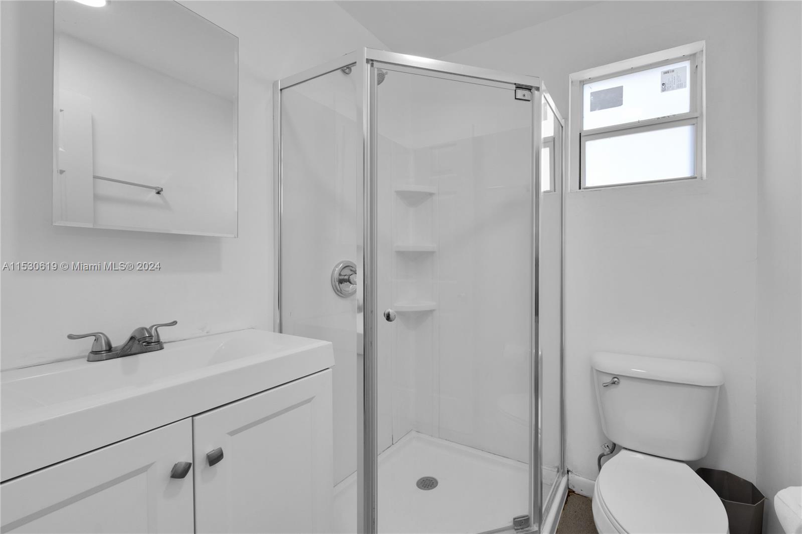 6520 Southwest 46th Street Miami, FL 33155 - Photo 26 of 40 a bathroom with a shower sink vanity and toilet