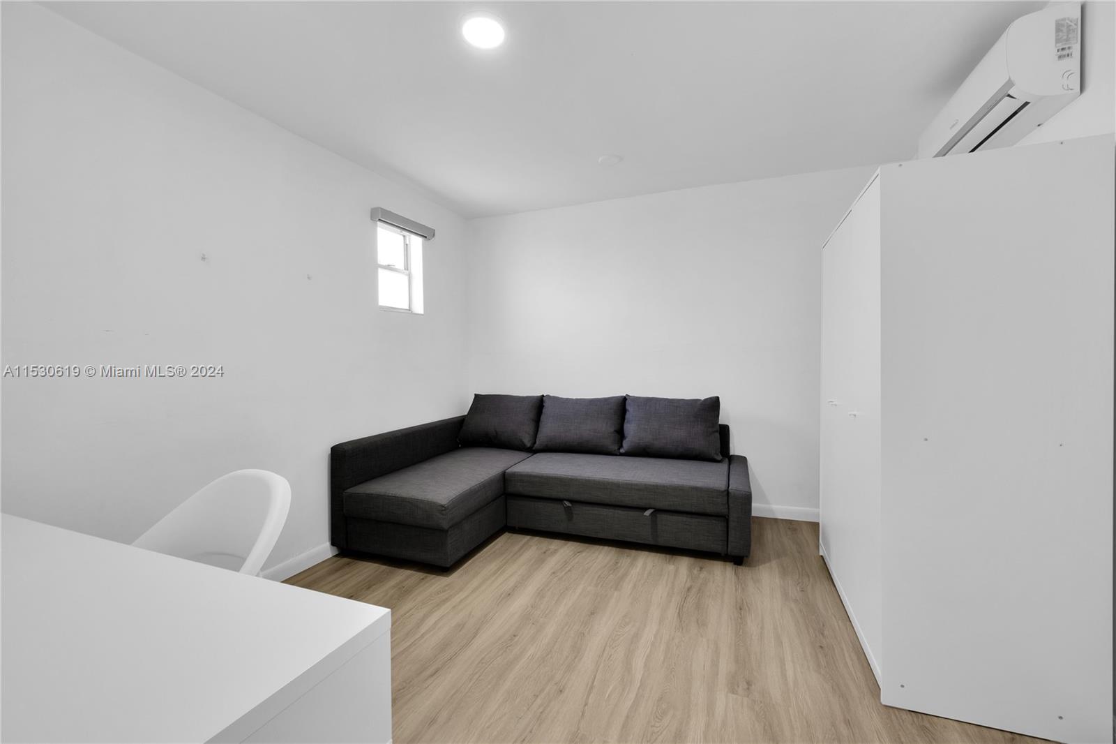 6520 Southwest 46th Street Miami, FL 33155 - Photo 27 of 40 a living room with furniture and a wooden floor