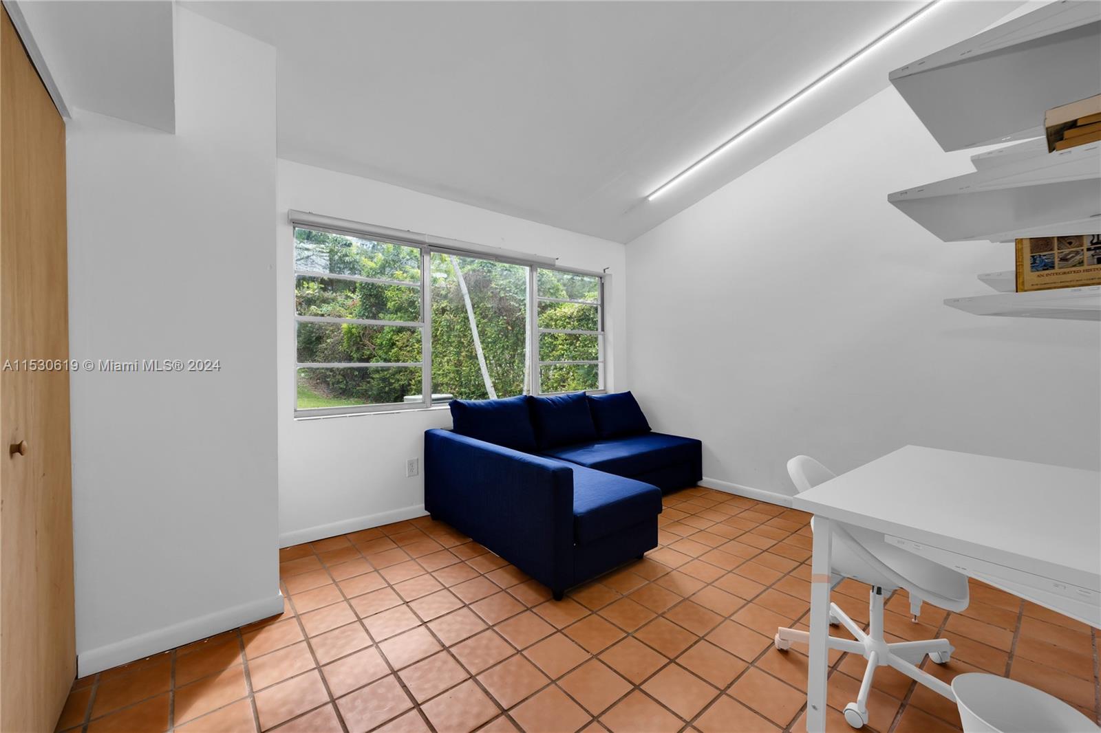6520 Southwest 46th Street Miami, FL 33155 - Photo 29 of 40 a living room with furniture and a window