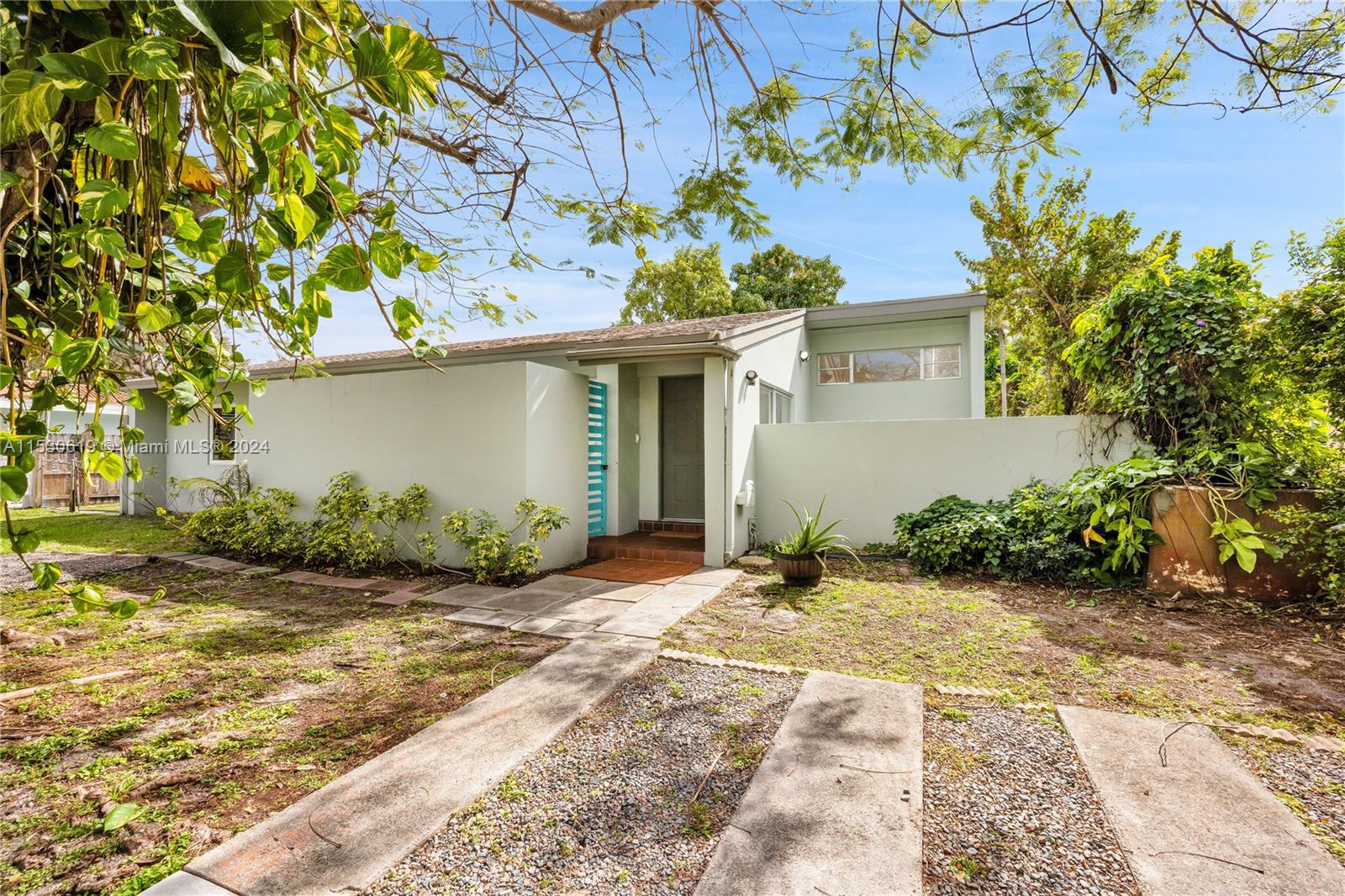 6520 Southwest 46th Street Miami, FL 33155 - Photo 3 of 40 a view of a house with a yard