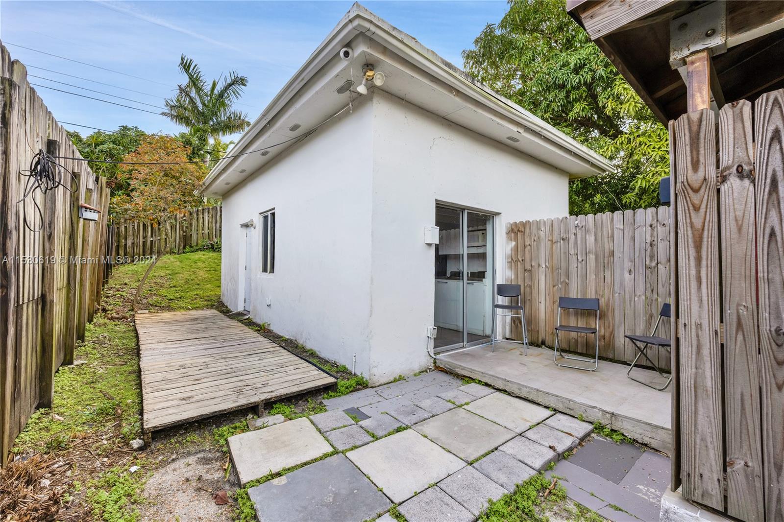 6520 Southwest 46th Street Miami, FL 33155 - Photo 33 of 40 a view of a wooden bench in front of a house
