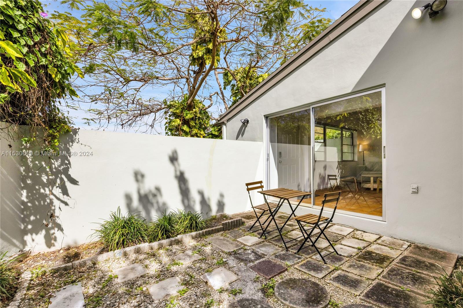 6520 Southwest 46th Street Miami, FL 33155 - Photo 6 of 40 a outdoor space with a table and chairs
