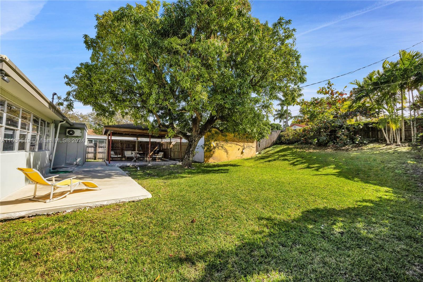 6520 Southwest 46th Street Miami, FL 33155 - Photo 7 of 40 a view of a house with backyard and sitting area