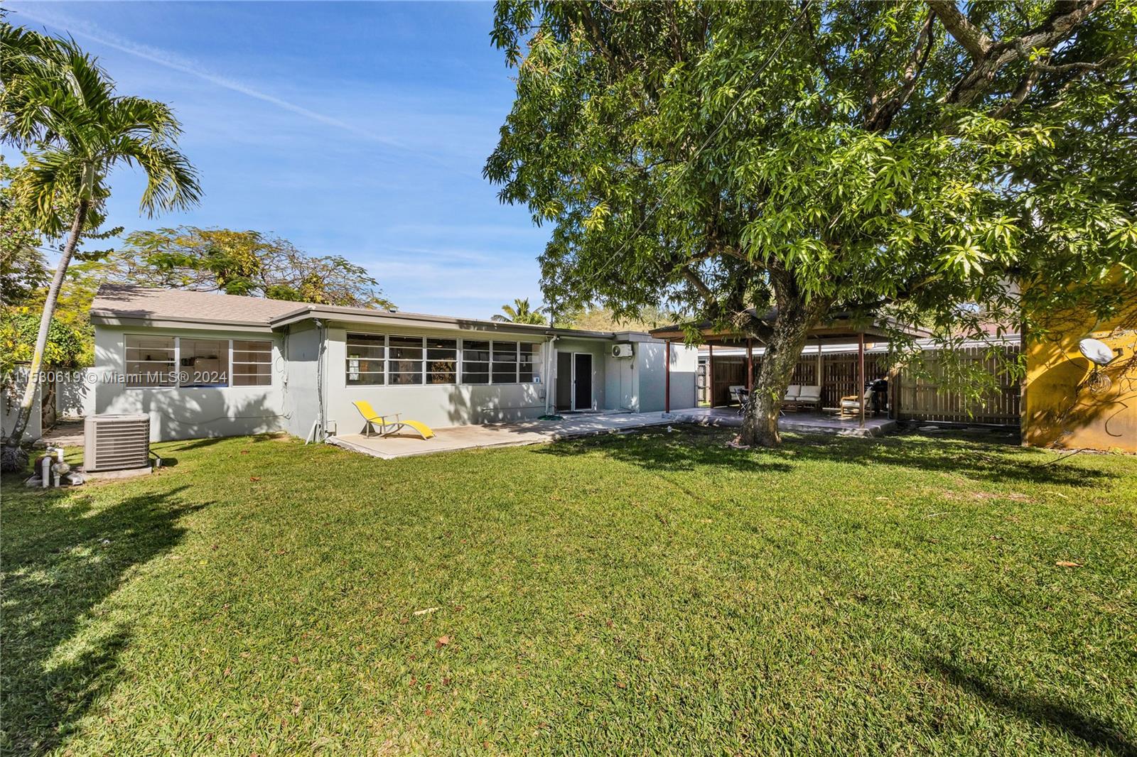 6520 Southwest 46th Street Miami, FL 33155 - Photo 8 of 40 a front view of a house with a garden