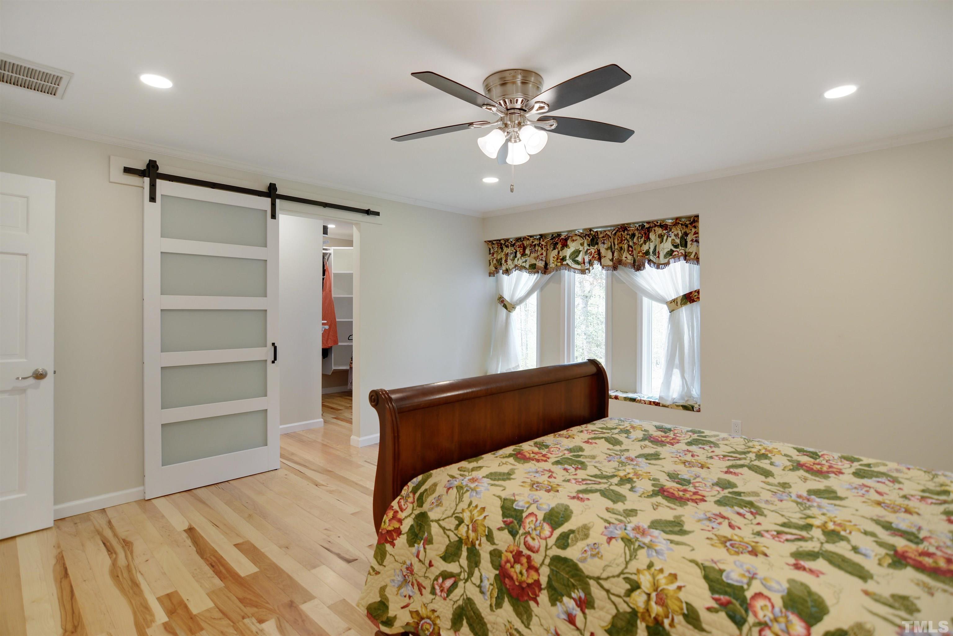 6120 Riverside Drive Wake Forest, NC 27587 - Photo 14 of 26 a bedroom with a bed and a window