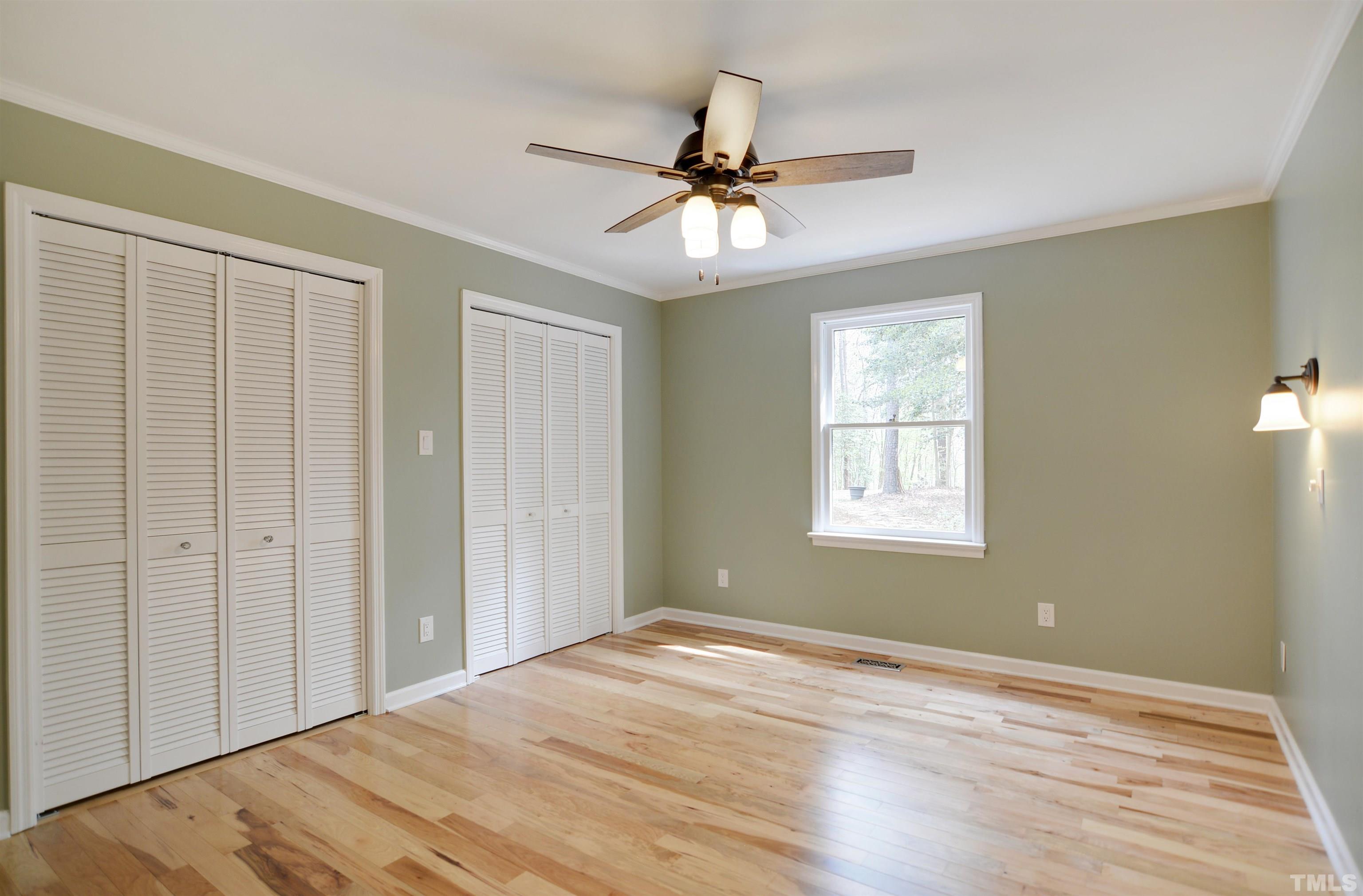 6120 Riverside Drive Wake Forest, NC 27587 - Photo 17 of 26 a view of an empty room with wooden floor and a window