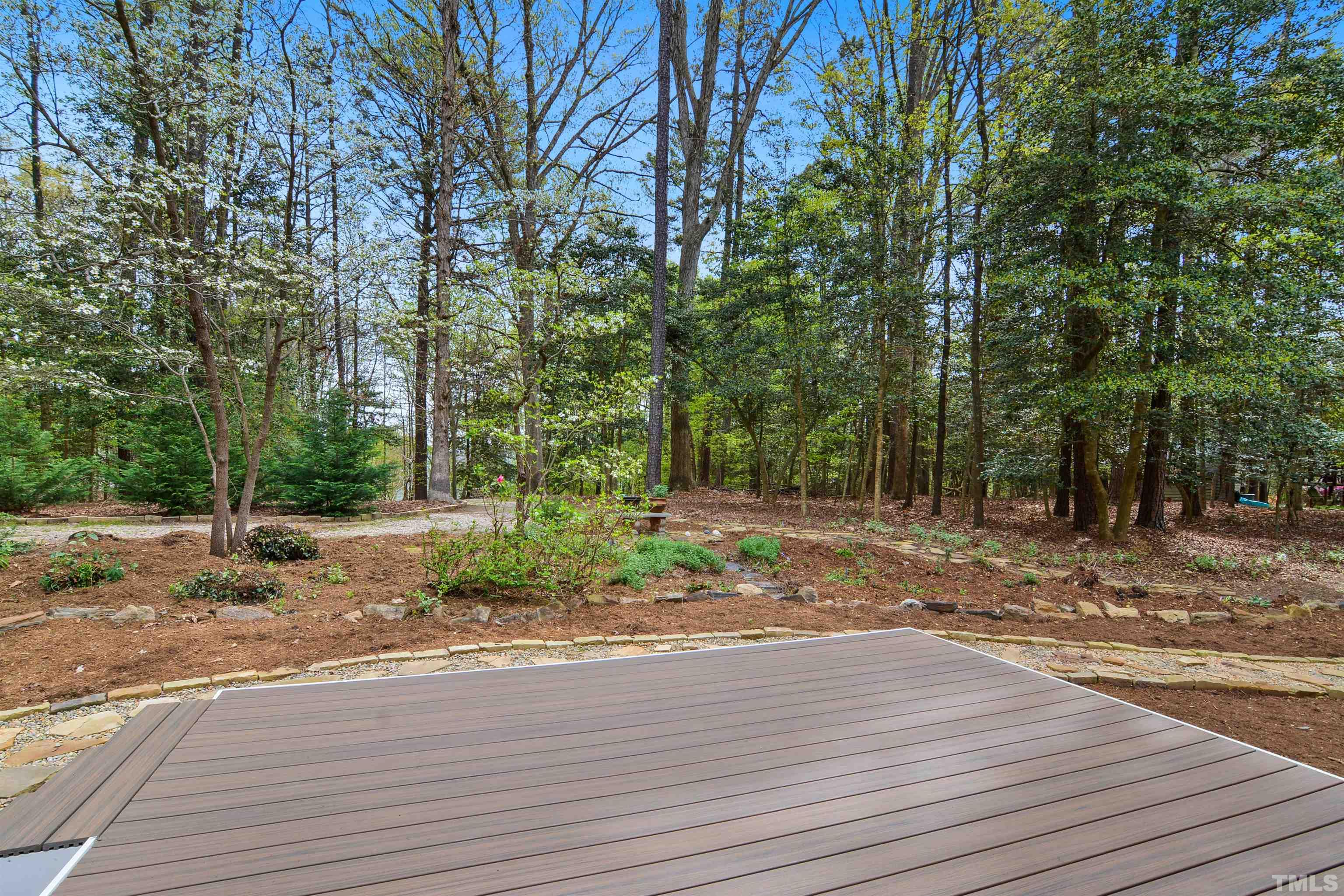 6120 Riverside Drive Wake Forest, NC 27587 - Photo 21 of 26 a view of a yard with plants and trees