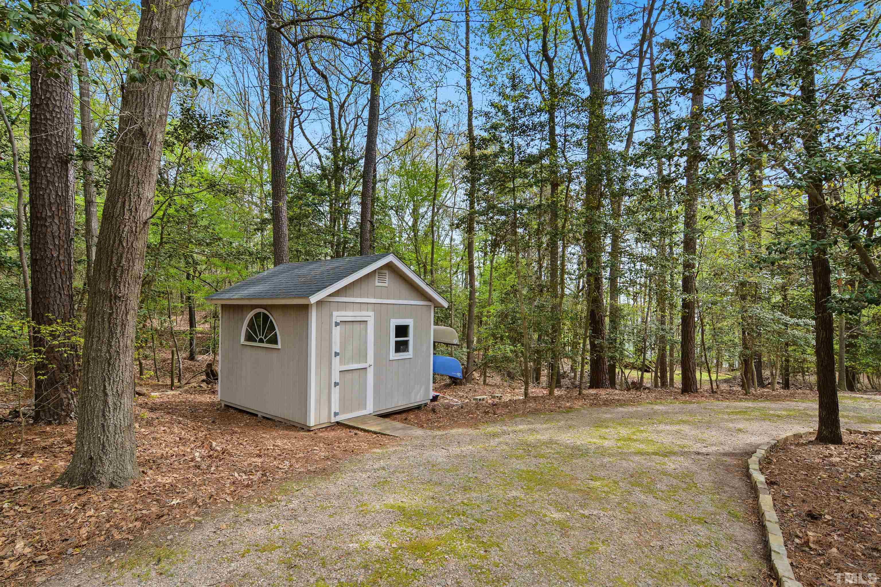 6120 Riverside Drive Wake Forest, NC 27587 - Photo 24 of 26 a view of a house with a backyard and trees
