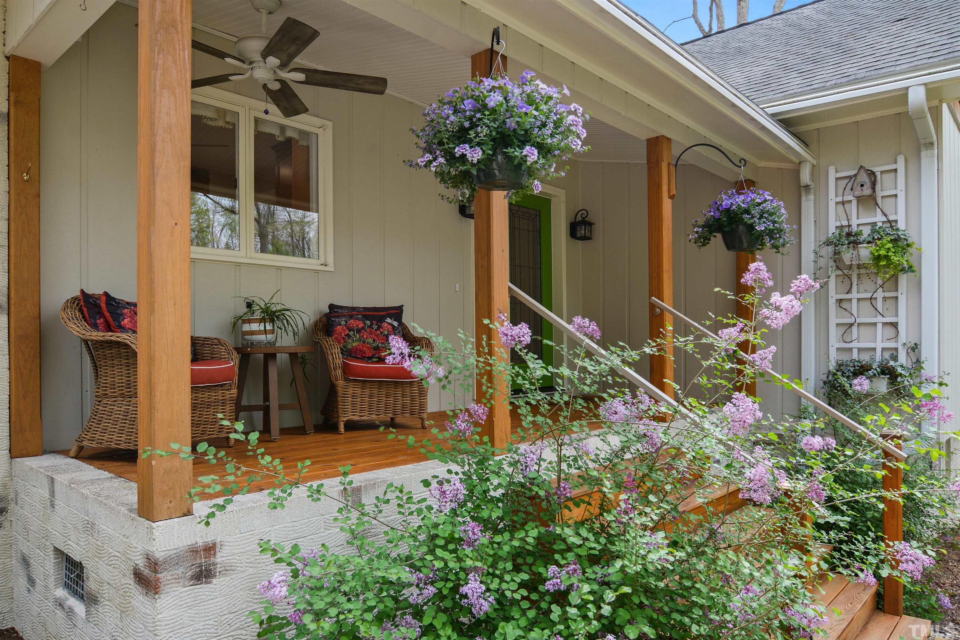 6120 Riverside Drive Wake Forest, NC 27587 - Photo 4 of 26 a potted plant sitting in front of a house