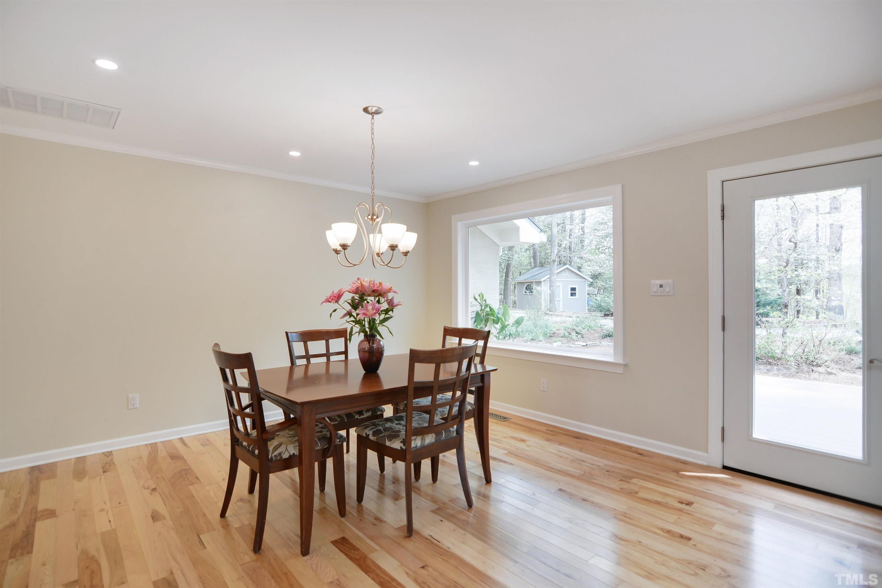 6120 Riverside Drive Wake Forest, NC 27587 - Photo 7 of 26 a view of a dining room with furniture window and outside view
