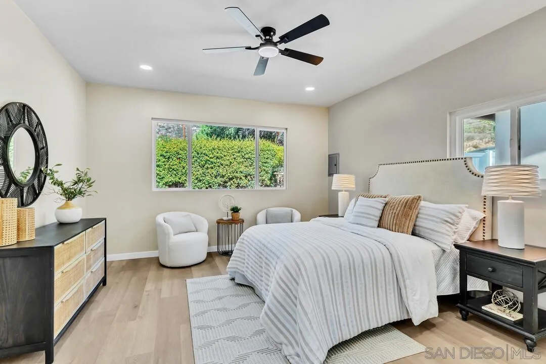 13725 Adrian Street Poway, CA 92064 - Photo 18 of 52 a bedroom with a bed and a large window