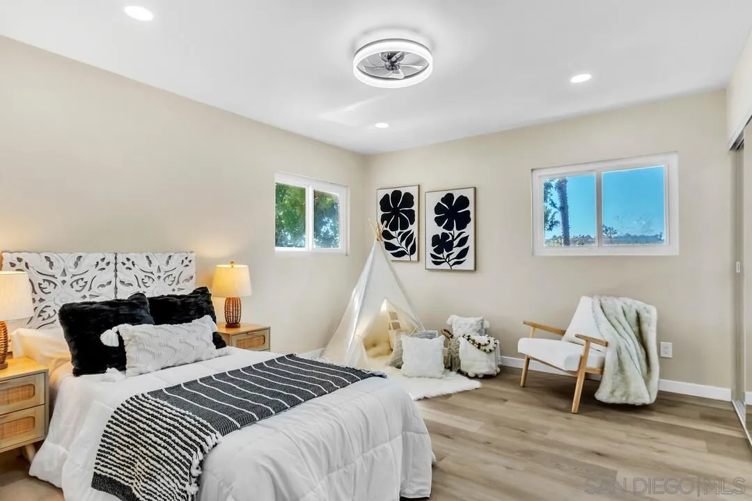 13725 Adrian Street Poway, CA 92064 - Photo 28 of 52 a bedroom with a bed and a couch