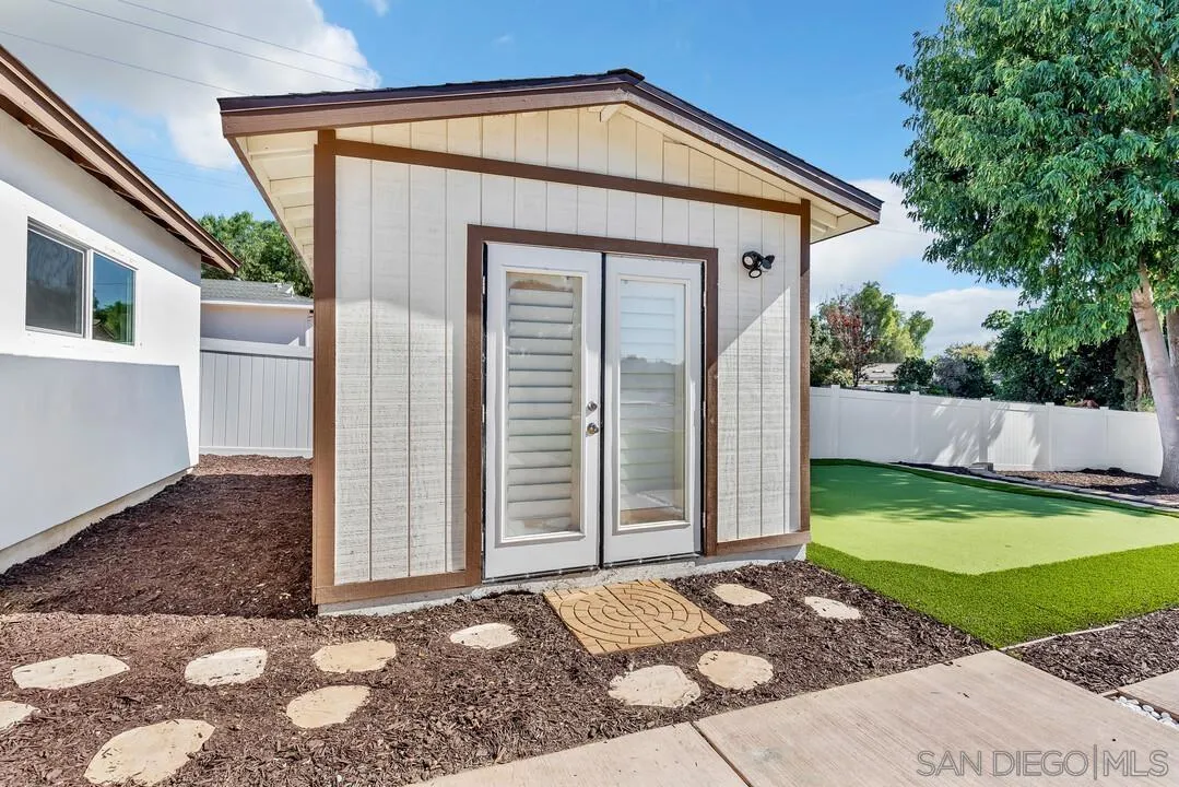 13725 Adrian Street Poway, CA 92064 - Photo 32 of 52 a front view of a house with garden