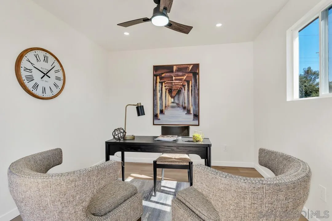 13725 Adrian Street Poway, CA 92064 - Photo 33 of 52 a living room with furniture and a wall painting