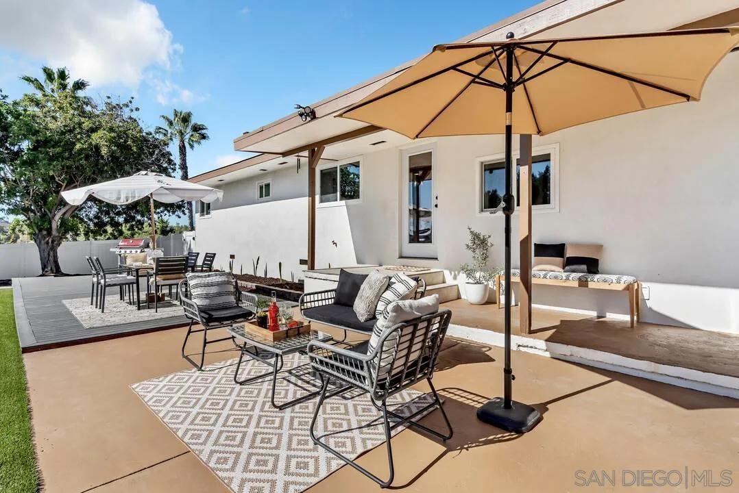 13725 Adrian Street Poway, CA 92064 - Photo 36 of 52 a outdoor space with patio the couches and a umbrella