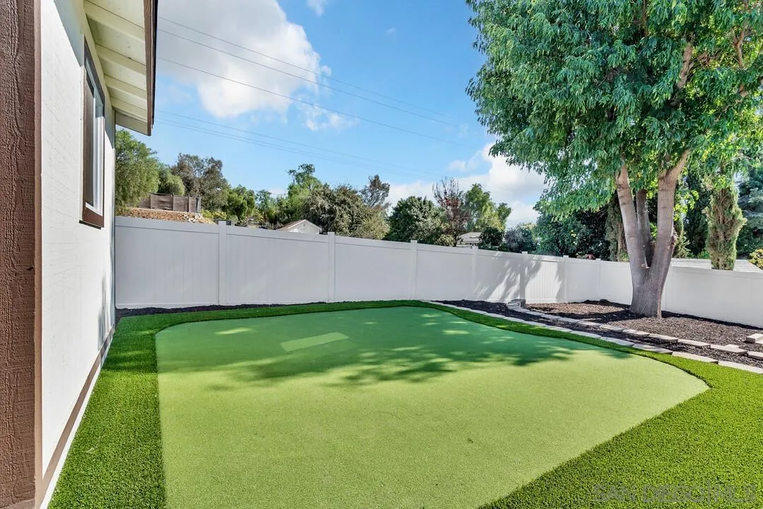 13725 Adrian Street Poway, CA 92064 - Photo 38 of 52 a view of a backyard with swimming pool