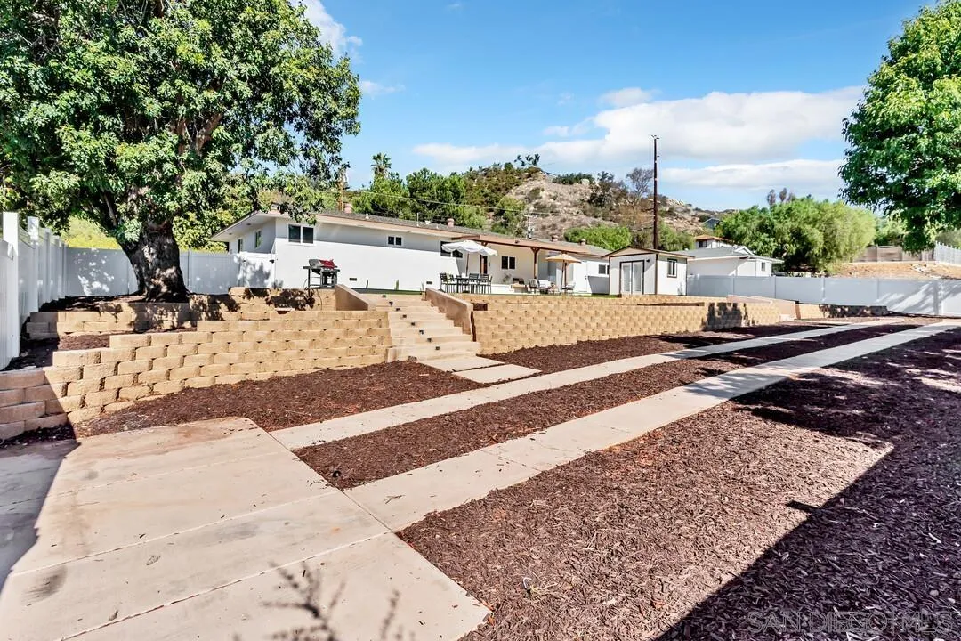 13725 Adrian Street Poway, CA 92064 - Photo 42 of 52 a view of a swimming pool with a lounge chairs
