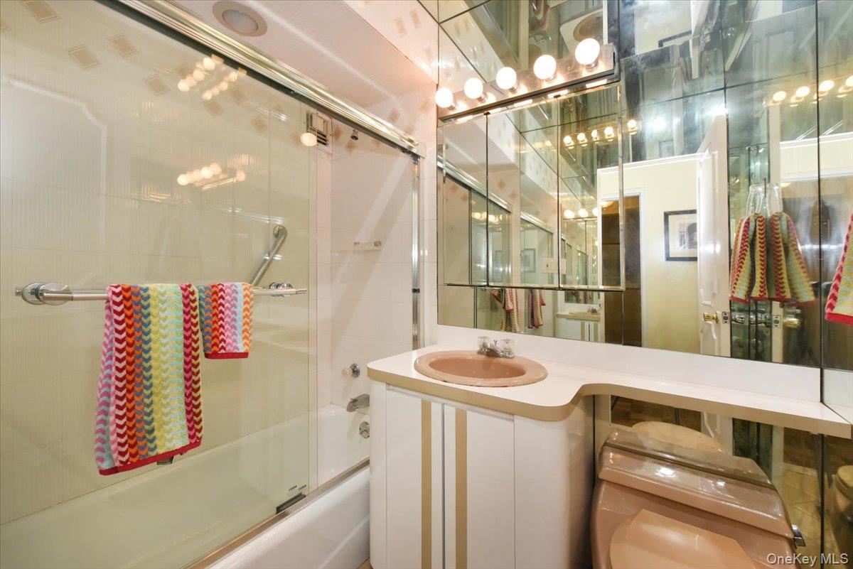 40 Stoner Avenue, Unit 1I Great Neck, NY 11021 - Photo 18 of 22 a bathroom with a sink and a shower