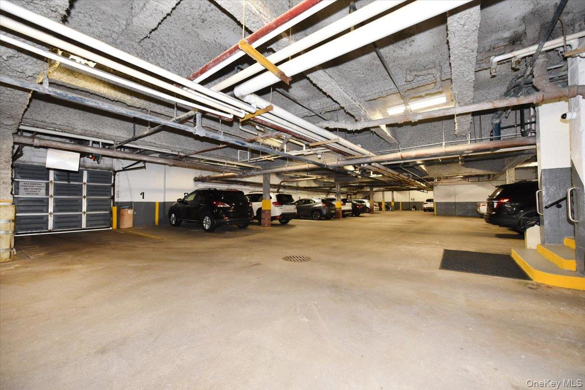 40 Stoner Avenue, Unit 1I Great Neck, NY 11021 - Photo 10 of 22 a view of parking garage with cars
