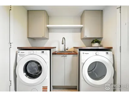 a bathroom with a double vanity sink mirror and toilet